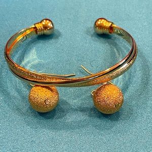 Premier Designs gold cuff with matching hook earrings